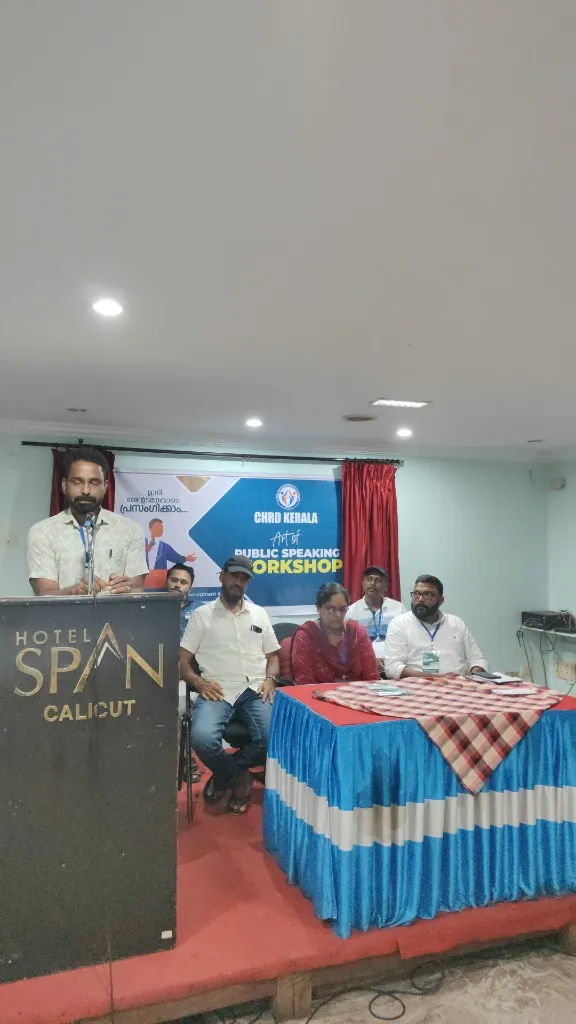 Speaker addressing audience at CHRD Training Academy public speaking workshop in Calicut