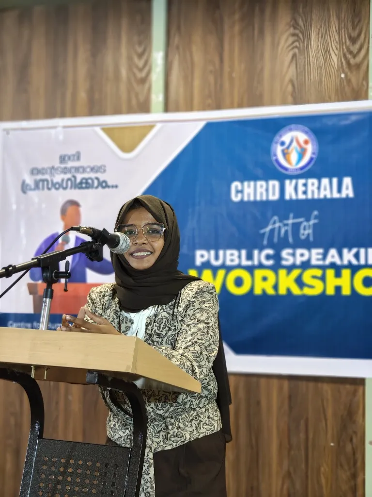 Female speaker addressing attendees at CHRD Training Academy public speaking workshop